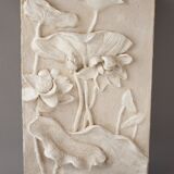 Bas-relief with flowers. Relief with flowers. Flowers in relief.