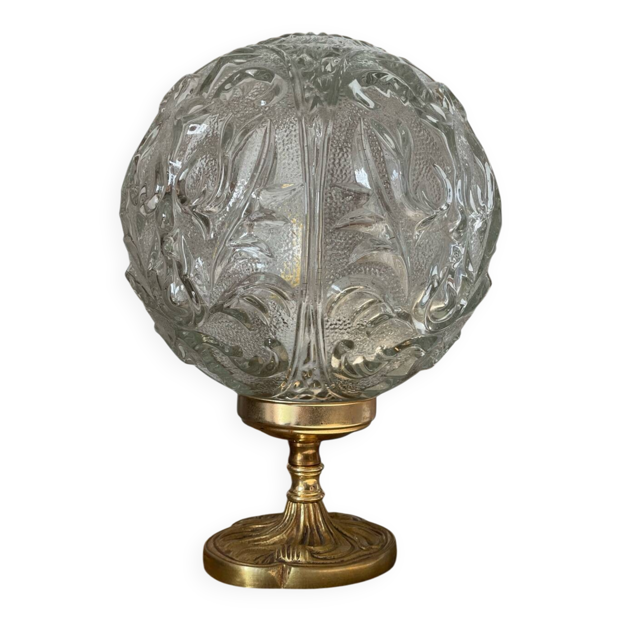 Textured round globe table lamp with a gold brass base