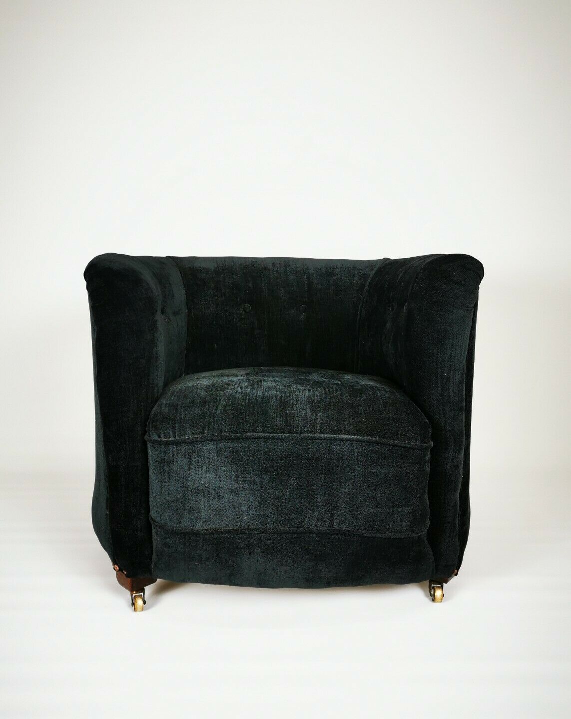 19th century black upholstered victorian tub chair on brass casters