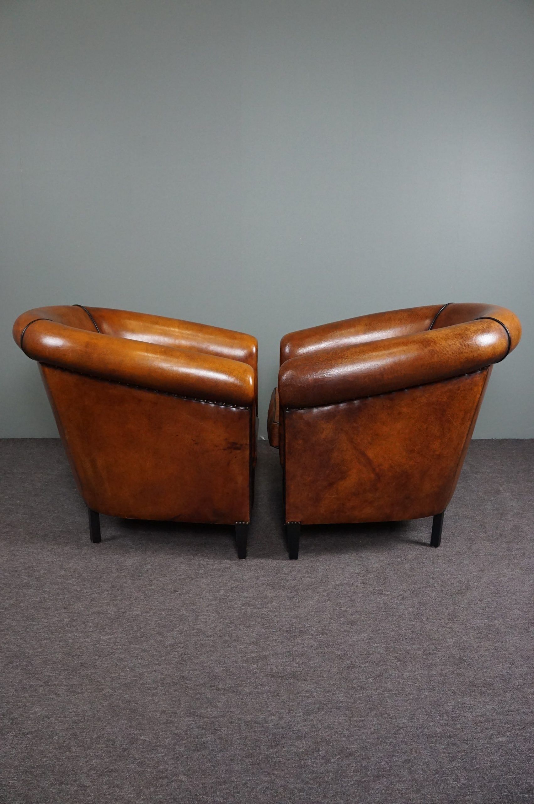 Set of 2 club chairs in black piping sheep leather