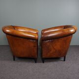 Set of 2 club chairs in black piping sheep leather