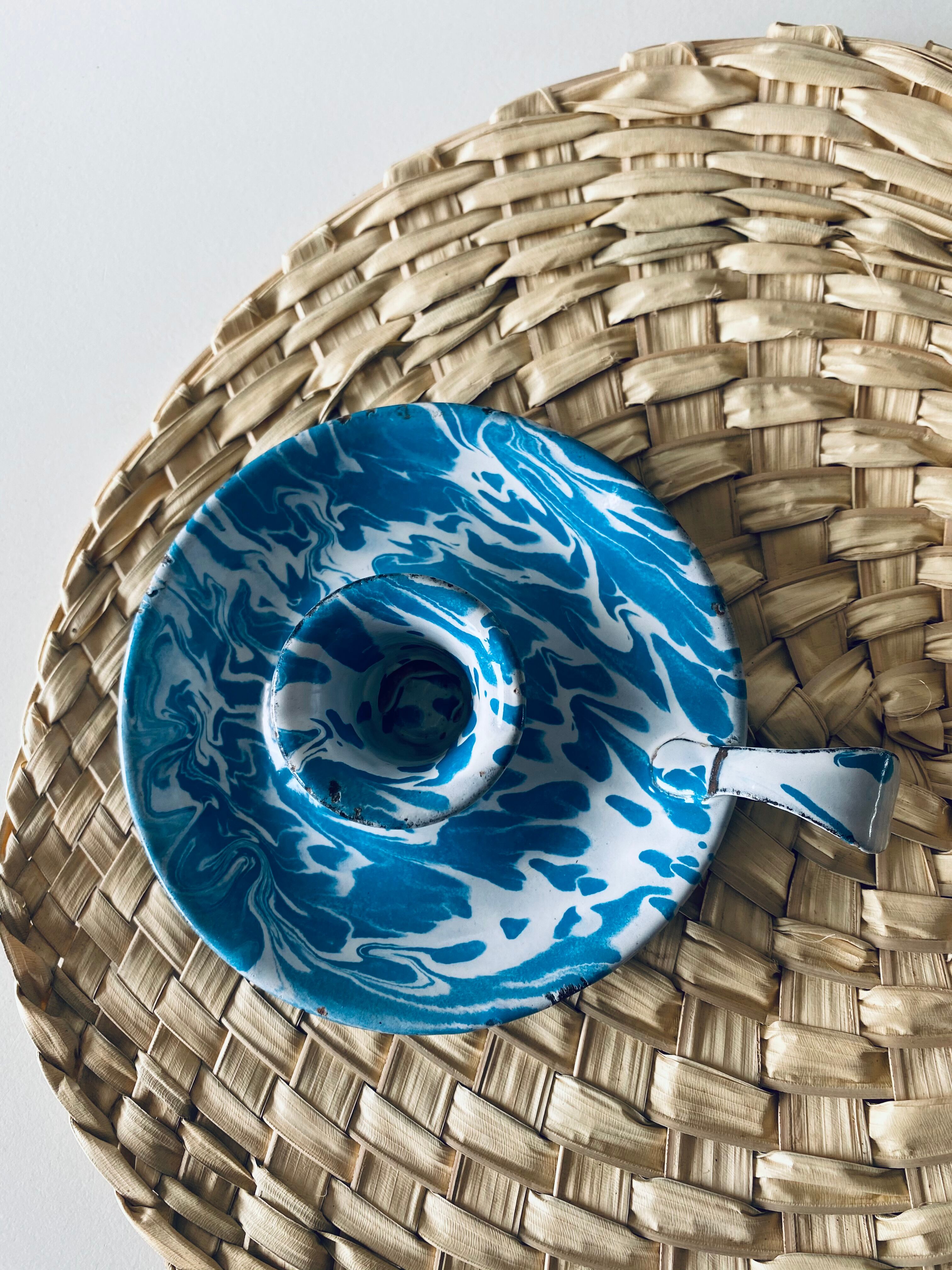 Old enamelled metal candlestick