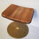 Old vintage rotary stool in gilded metal and seat in teak