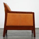 Fauteuil design artdeco en cuir de vache. grand confort et détails uniques