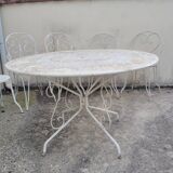 Wrought iron garden furniture from the early 20th century.