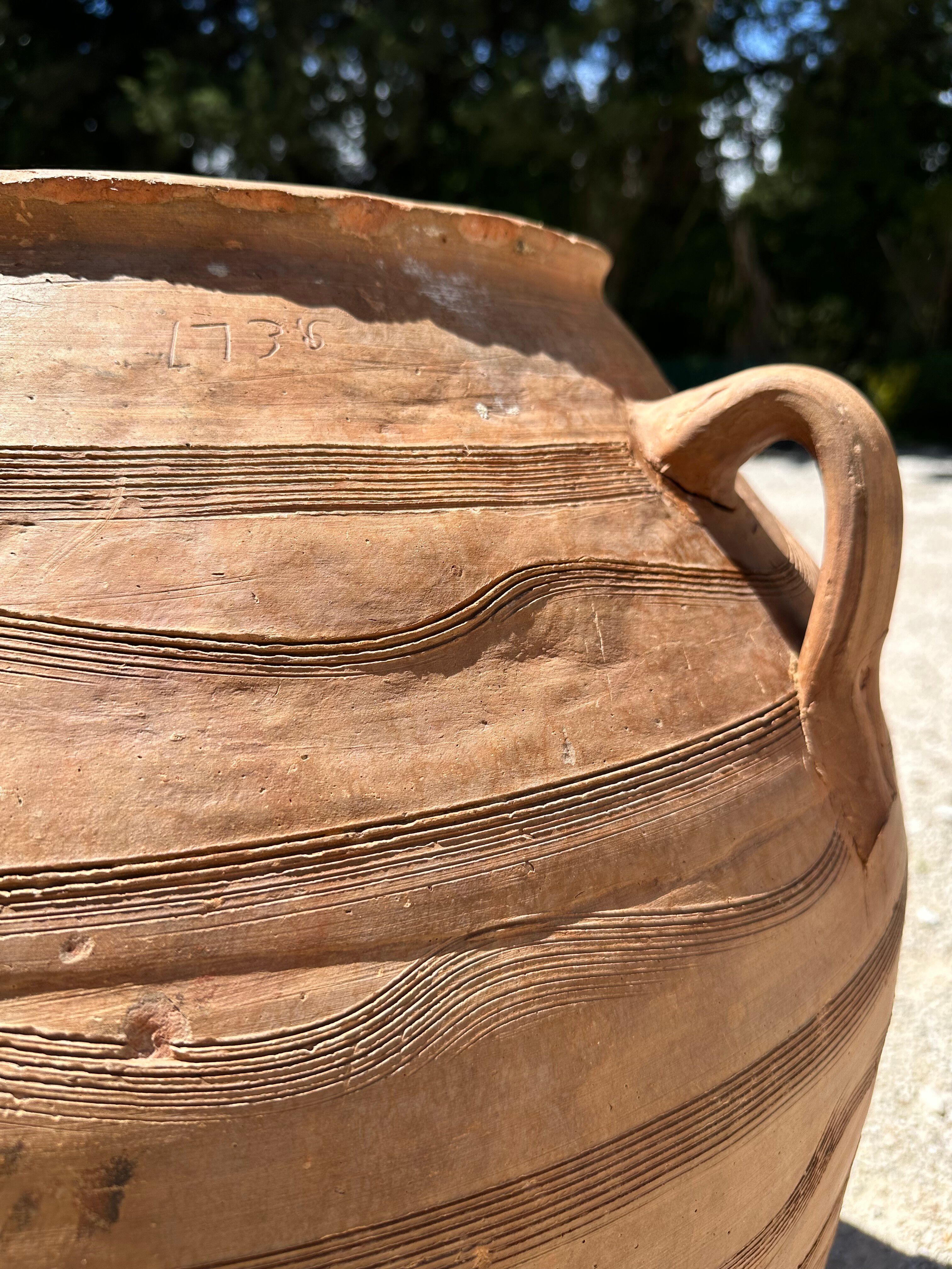 Ancient terracotta pottery jar from the 19th century.