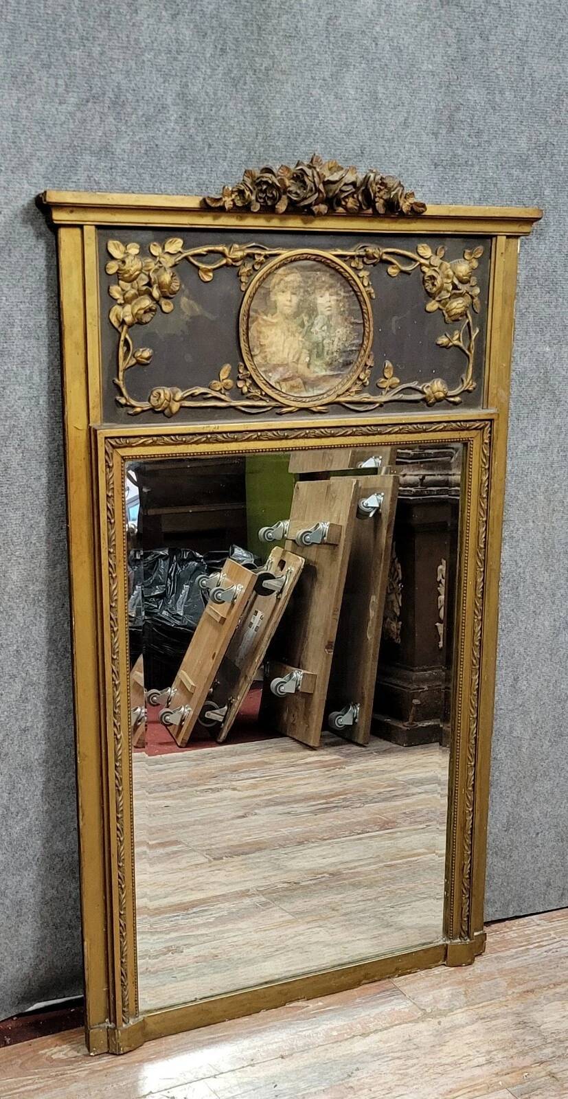 Louis XVI style trumeau mirror in wood and gilded stucco circa 1880