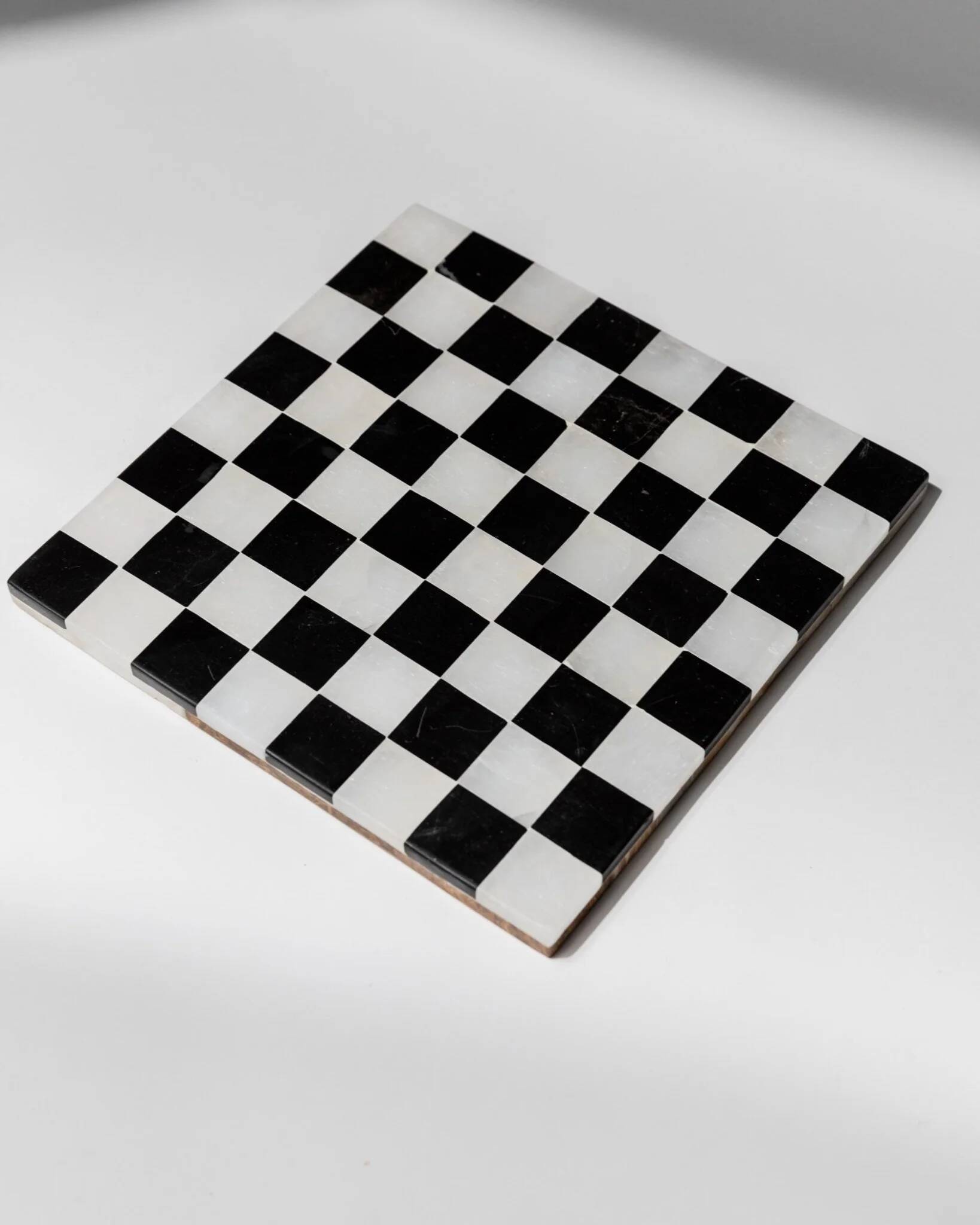 Vintage black-and-white marble chessboard with matching marble pieces, Italian 1960s design, sculptural centerpiece