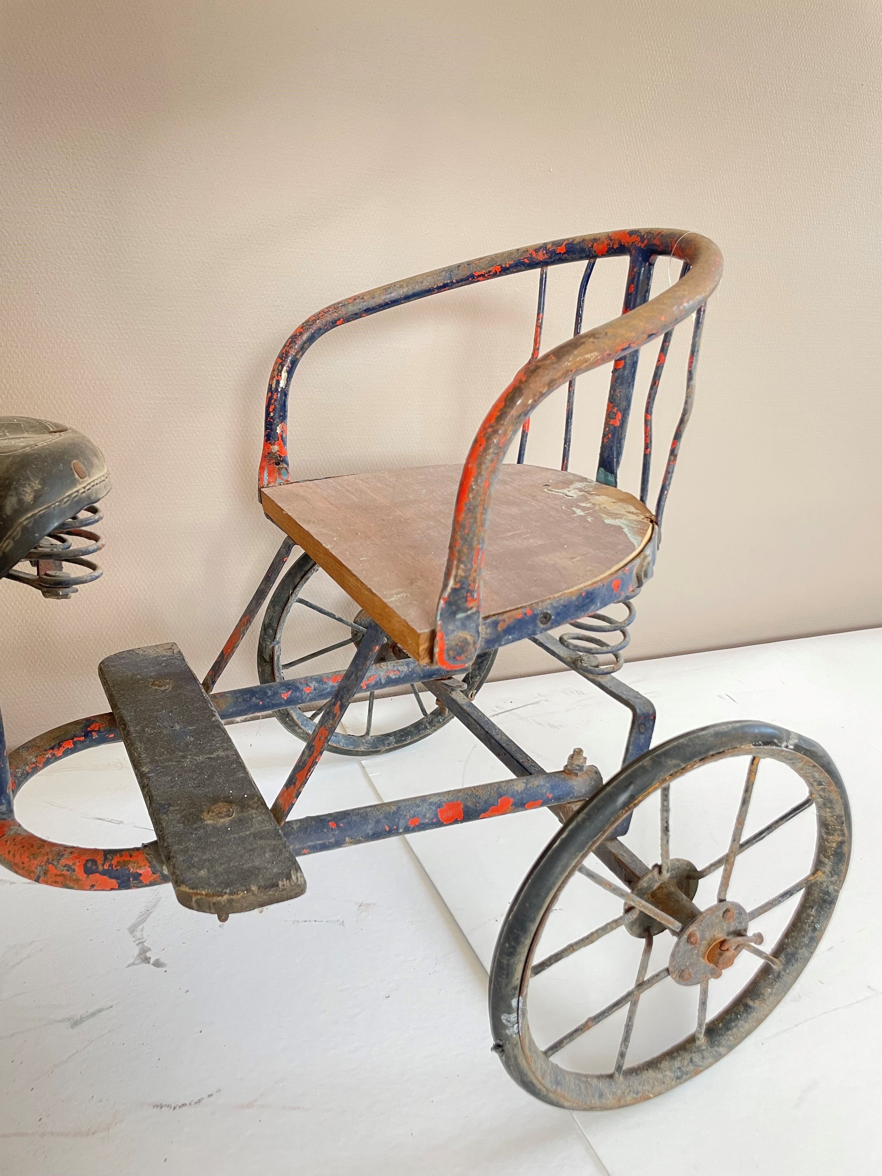 Vintage two-seater antique tricycle