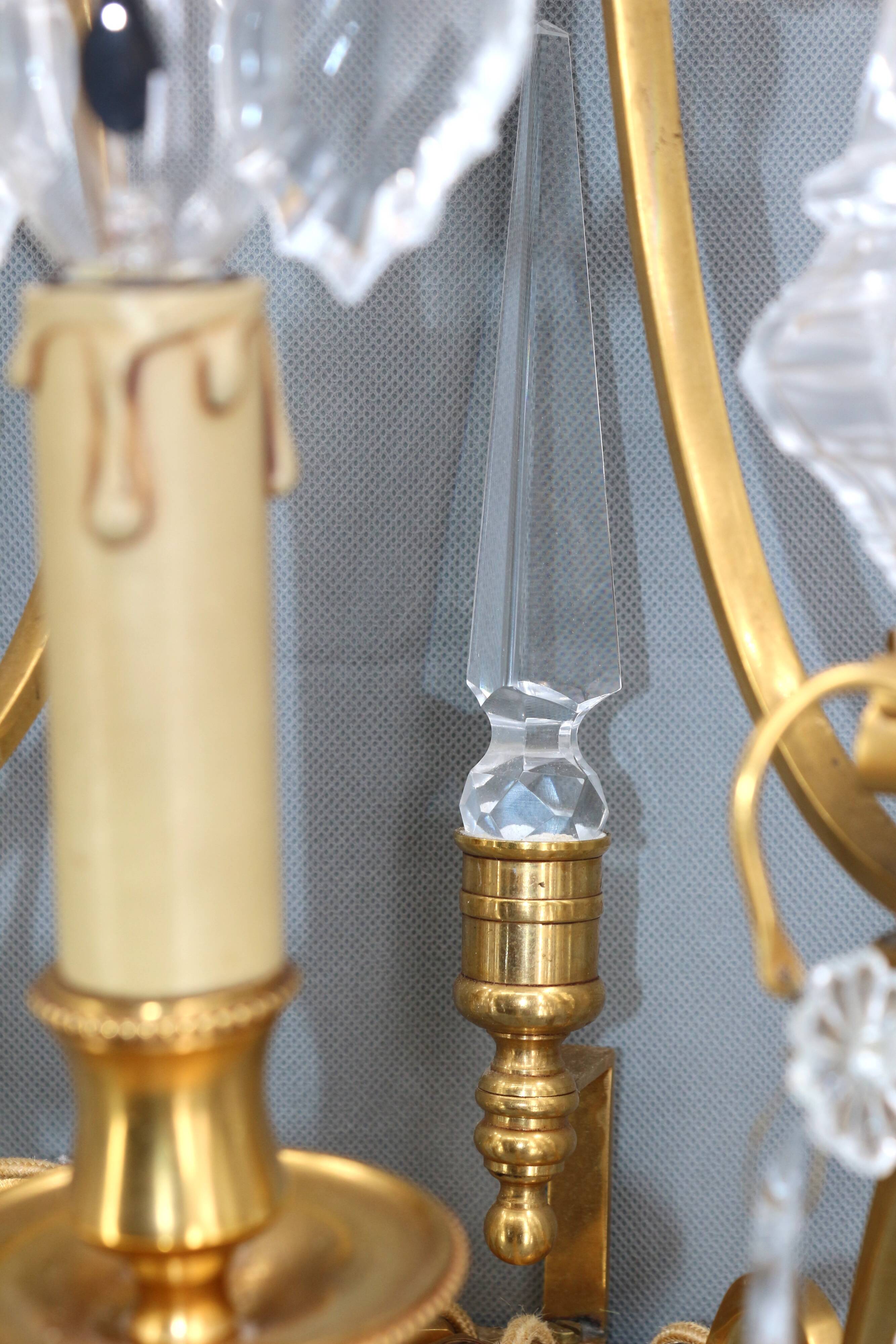 Pair of Louis XVI style gilded bronze & bohemian crystal sconces