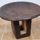 African monoxyle side table in carved wood with a curved top, 48x36 cm.