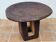 African monoxyle side table in carved wood with a curved top, 48x36 cm.