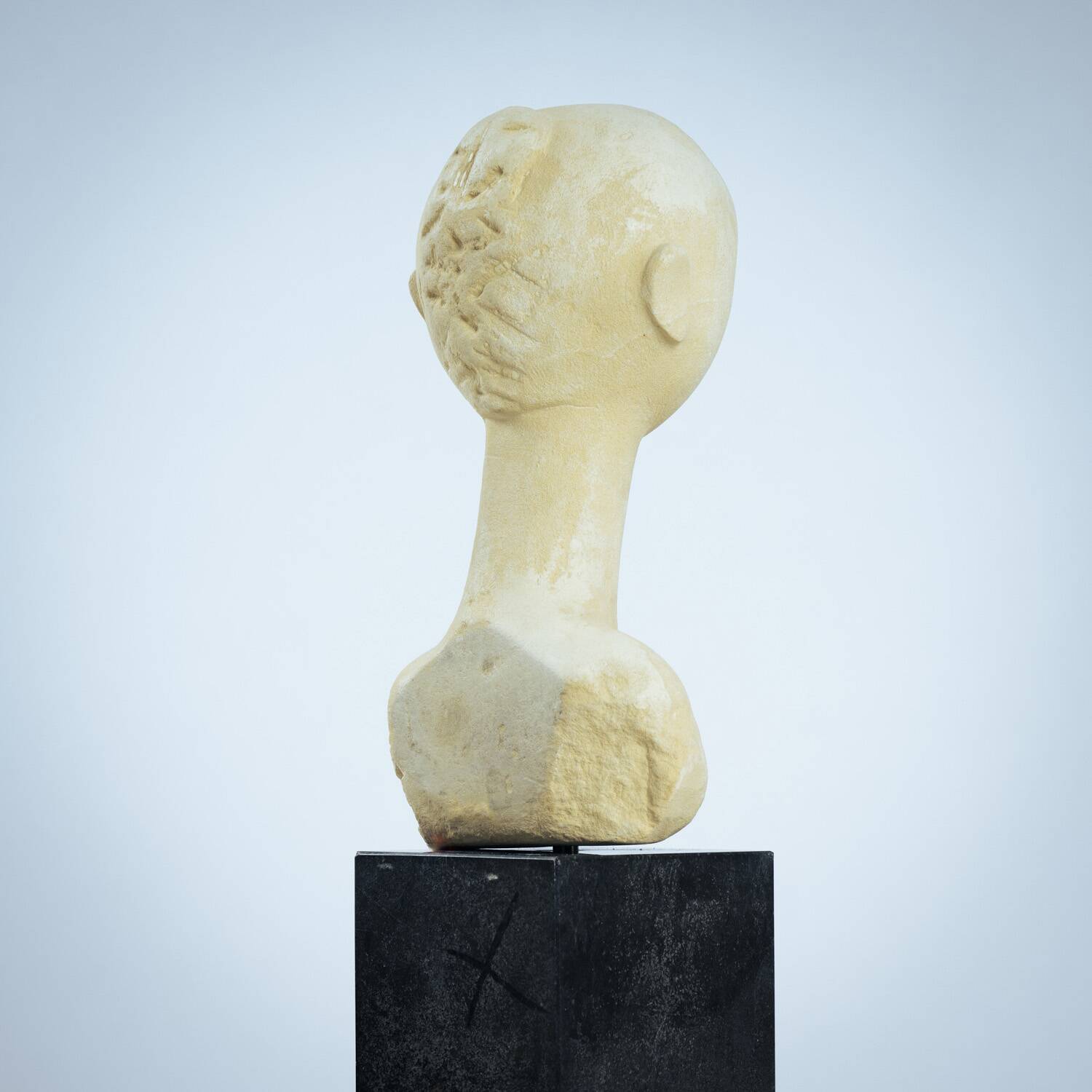 Modernist bust sculpture of a woman in sandstone
