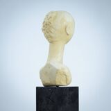 Modernist bust sculpture of a woman in sandstone