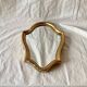 Miroir mural vintage en bois doré
