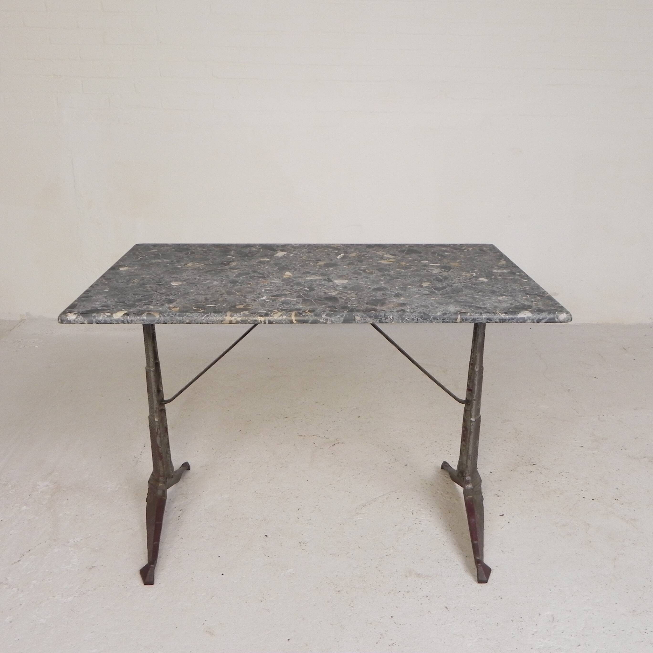 Bistro table with a marble top on a cast iron frame, 1930s.