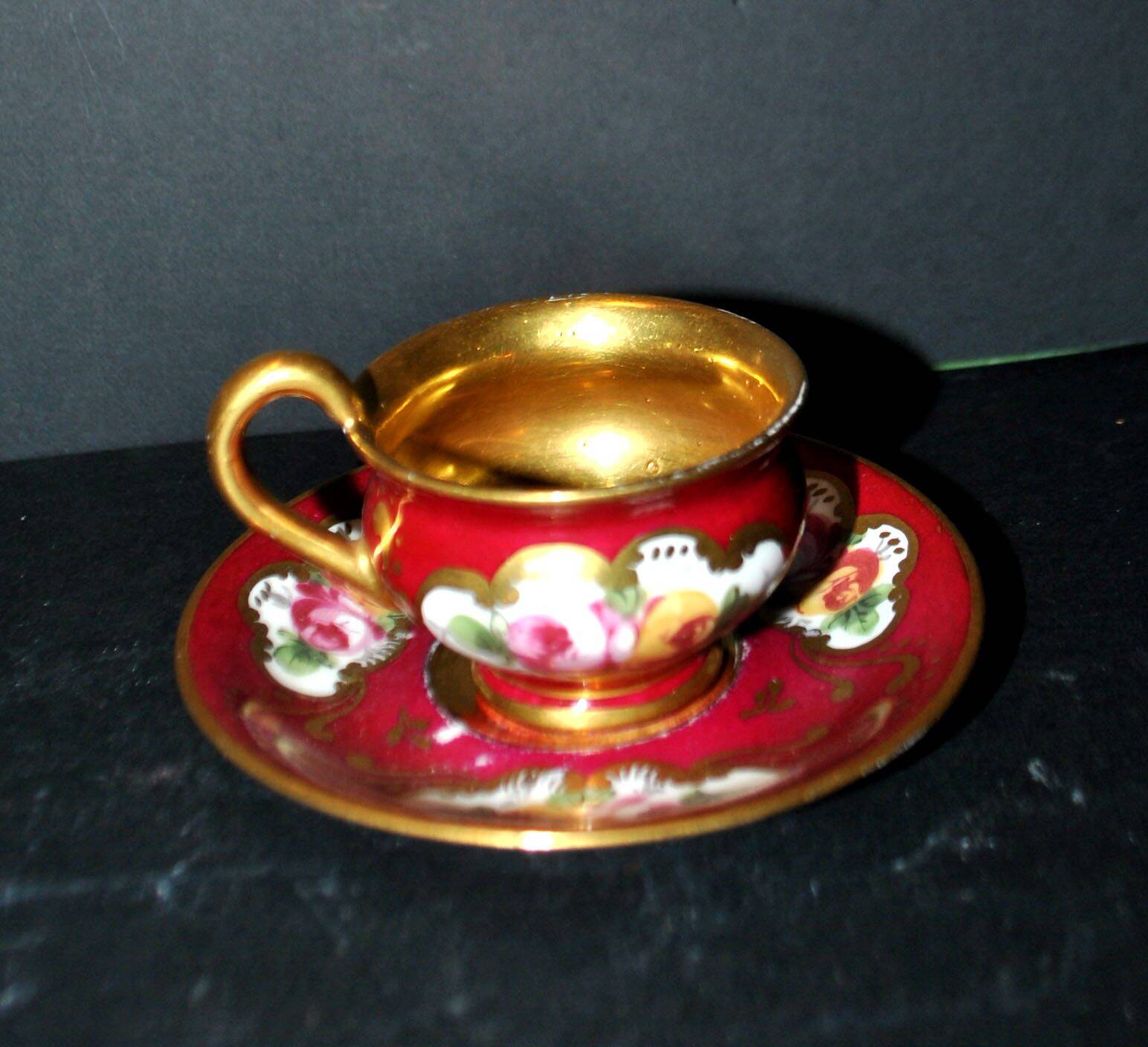 Limoges precious porcelain cup decorated in fuchsia pink and gold, signed MAB