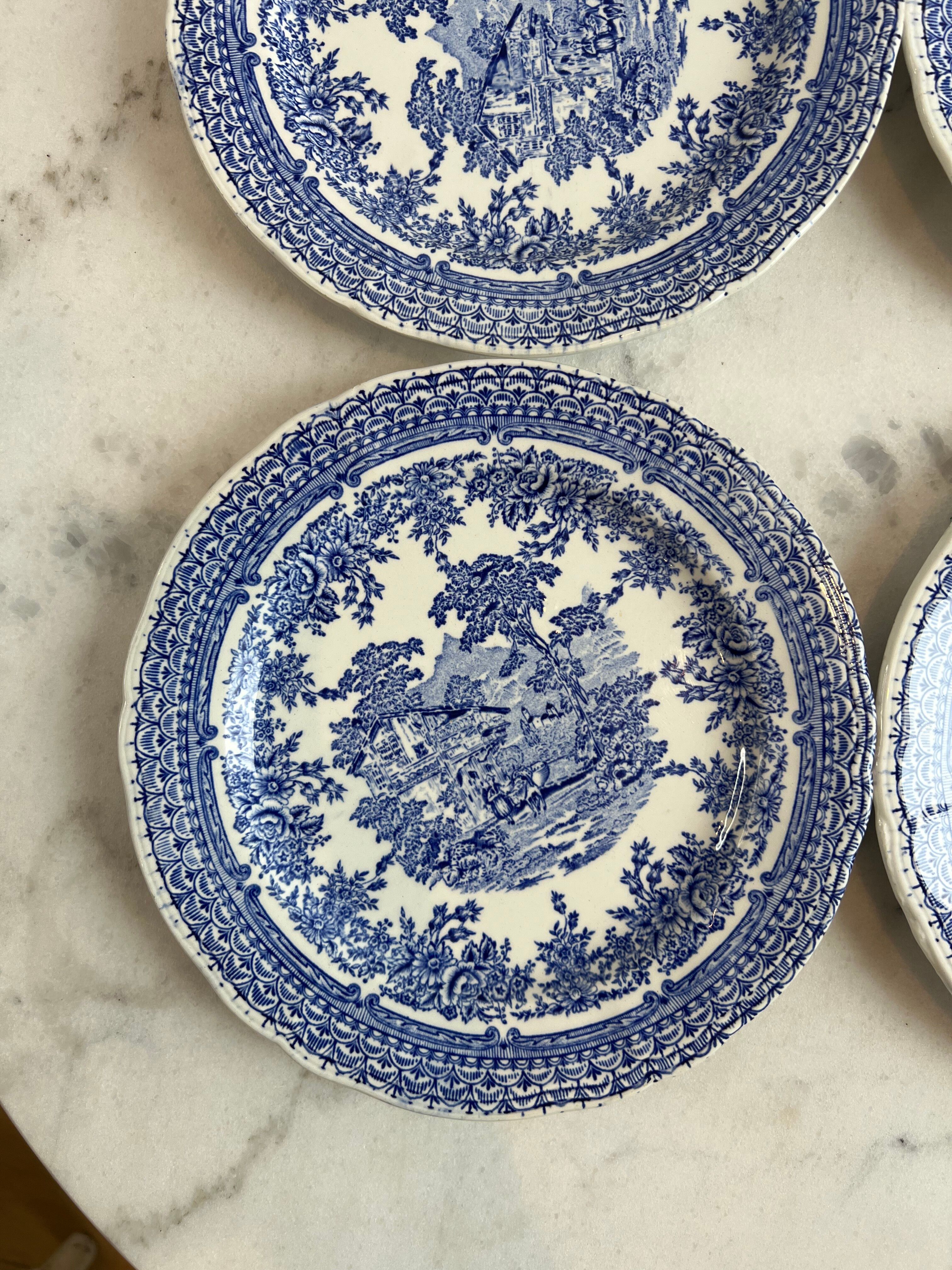 Set of four flat plates from English earthenware.