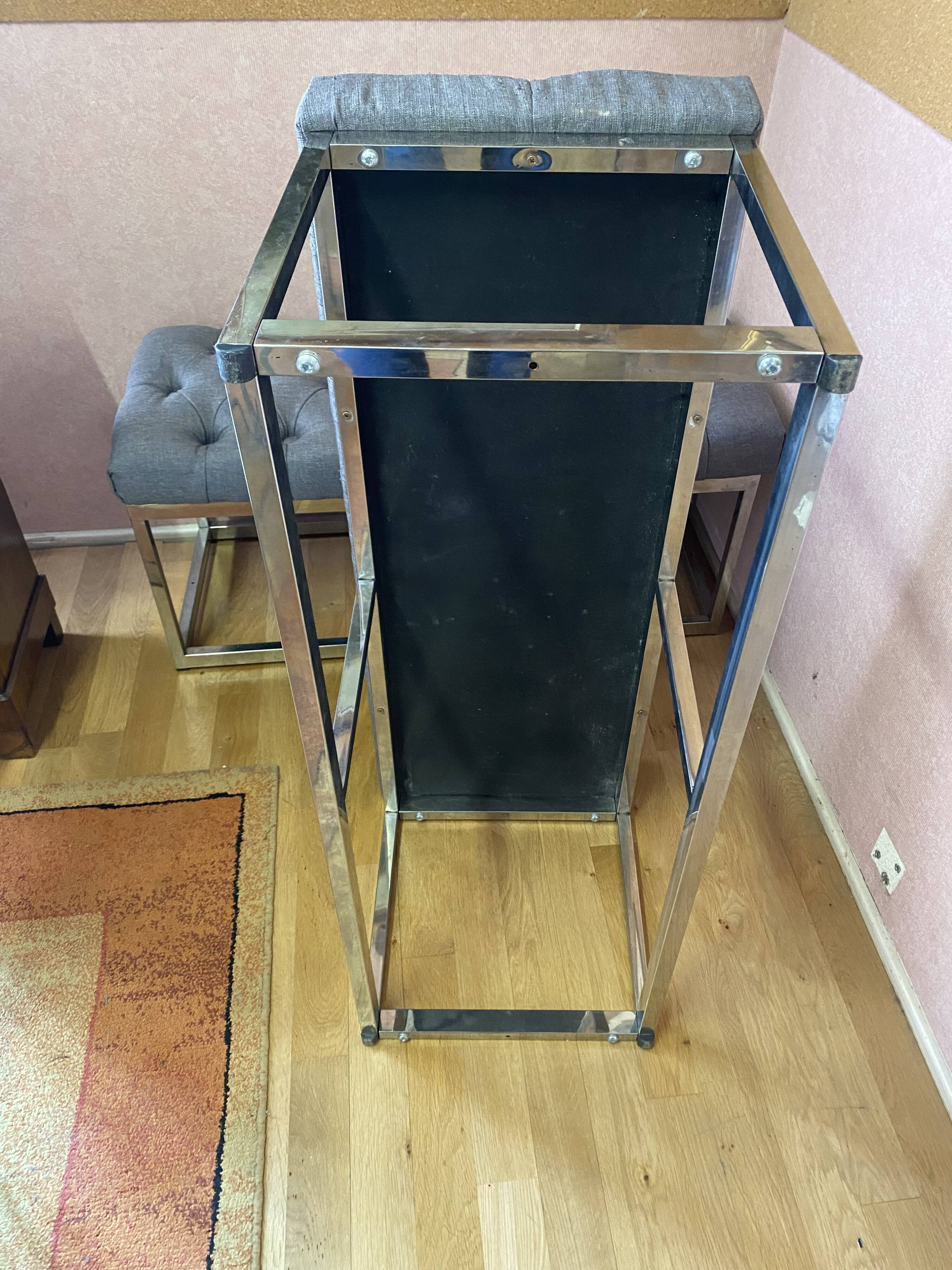 Pair of benches in chrome metal and padded gray fabric