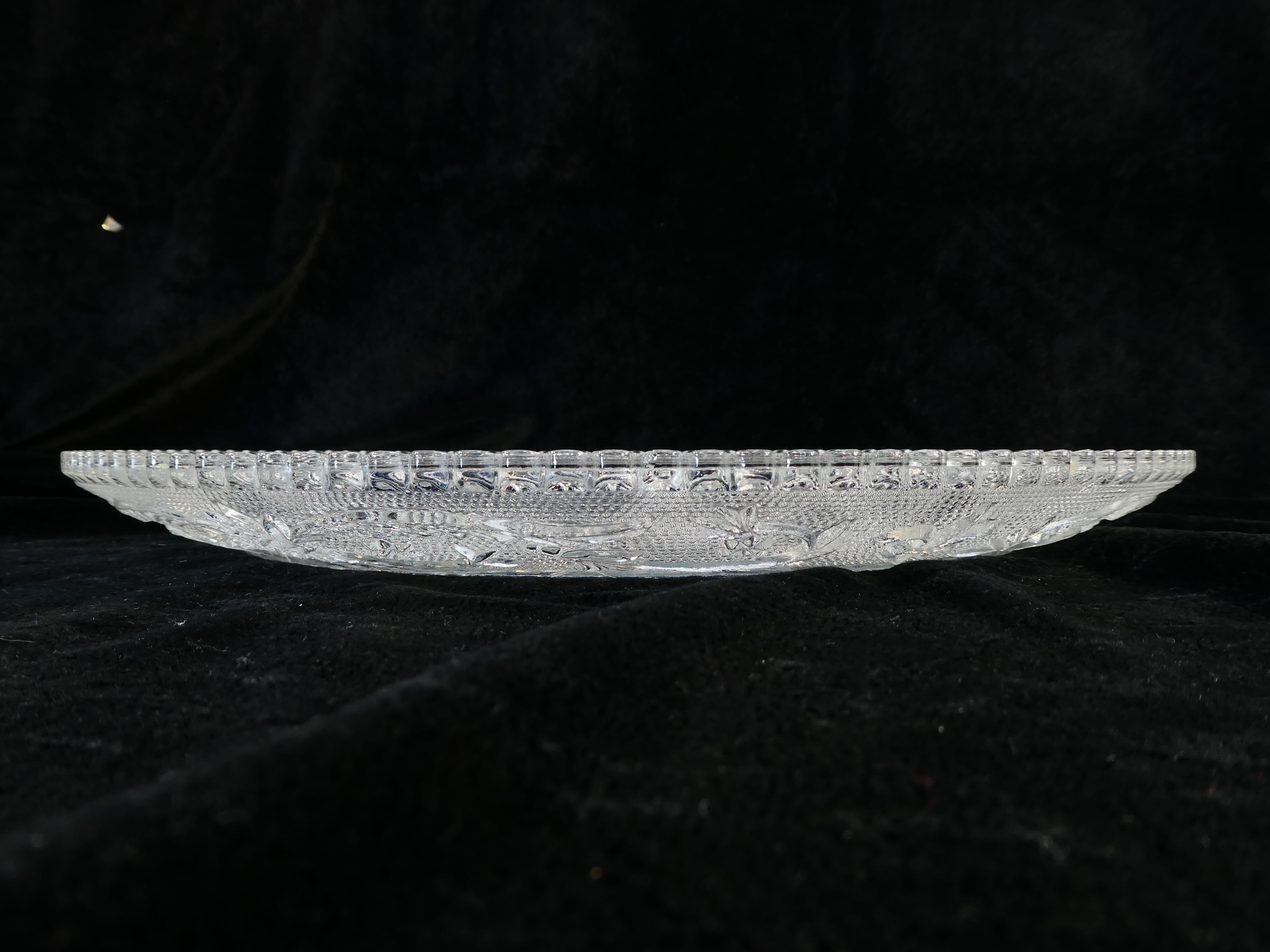 Old plate with pressed glass arabesque pie