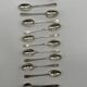 Service of 12 silver-plated metal coffee spoons with tongs and box from around 1900.
