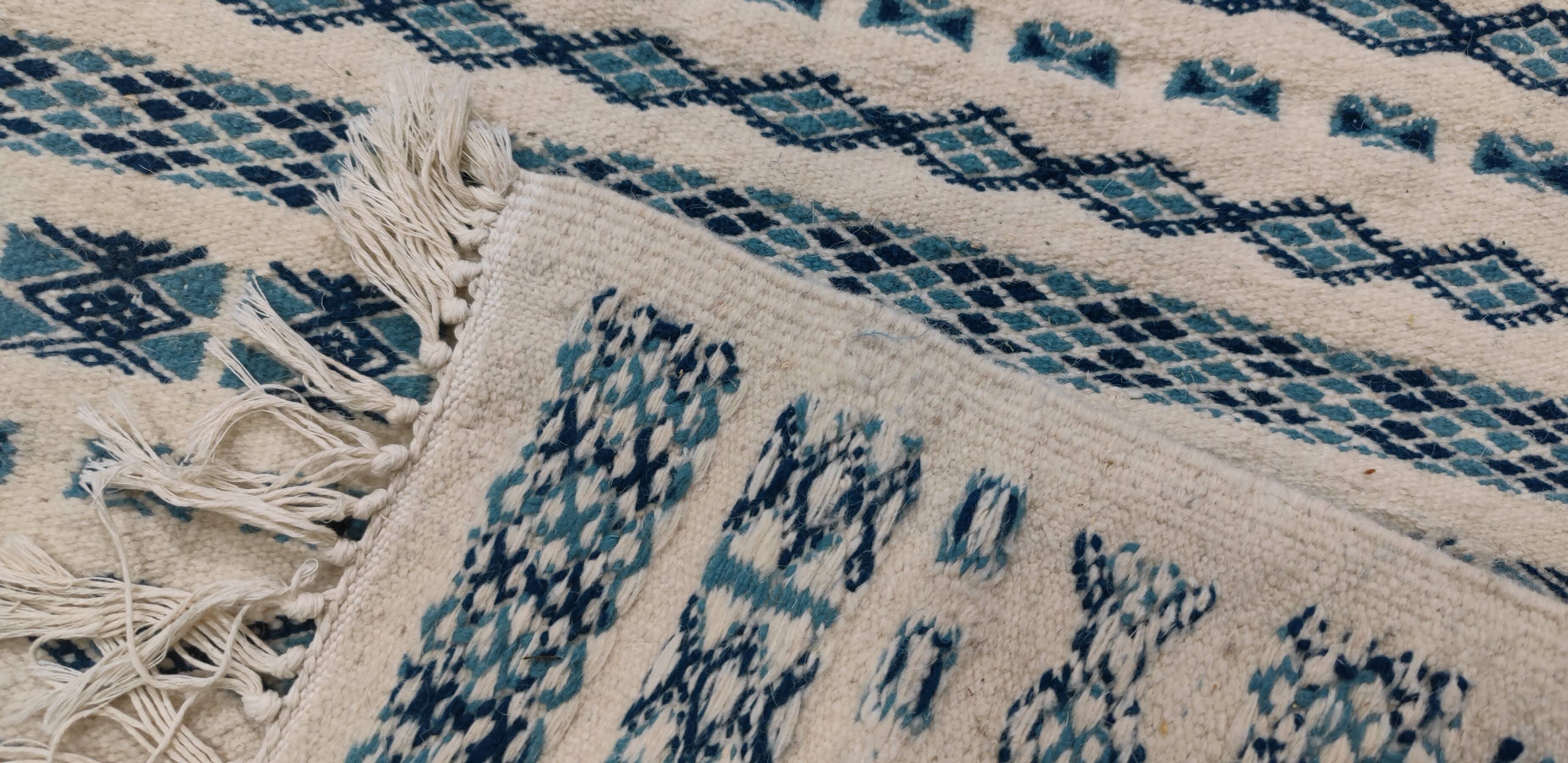 Traditional handmade white and blue carpet