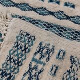 Traditional handmade white and blue carpet