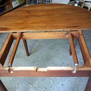 Elegant round teak table with extension.