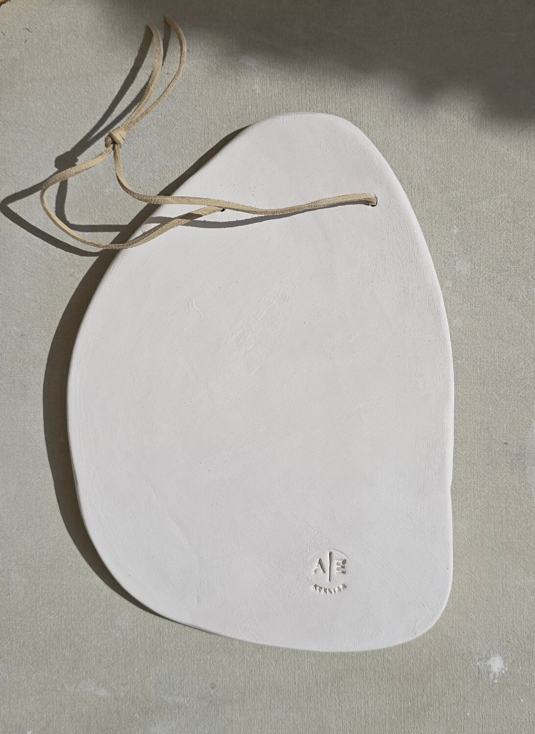 Mediterranean sculpted plaque