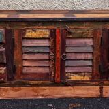 Furniture low in colorful wood. 12 drawers and 1 door