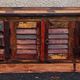 Furniture low in colorful wood. 12 drawers and 1 door
