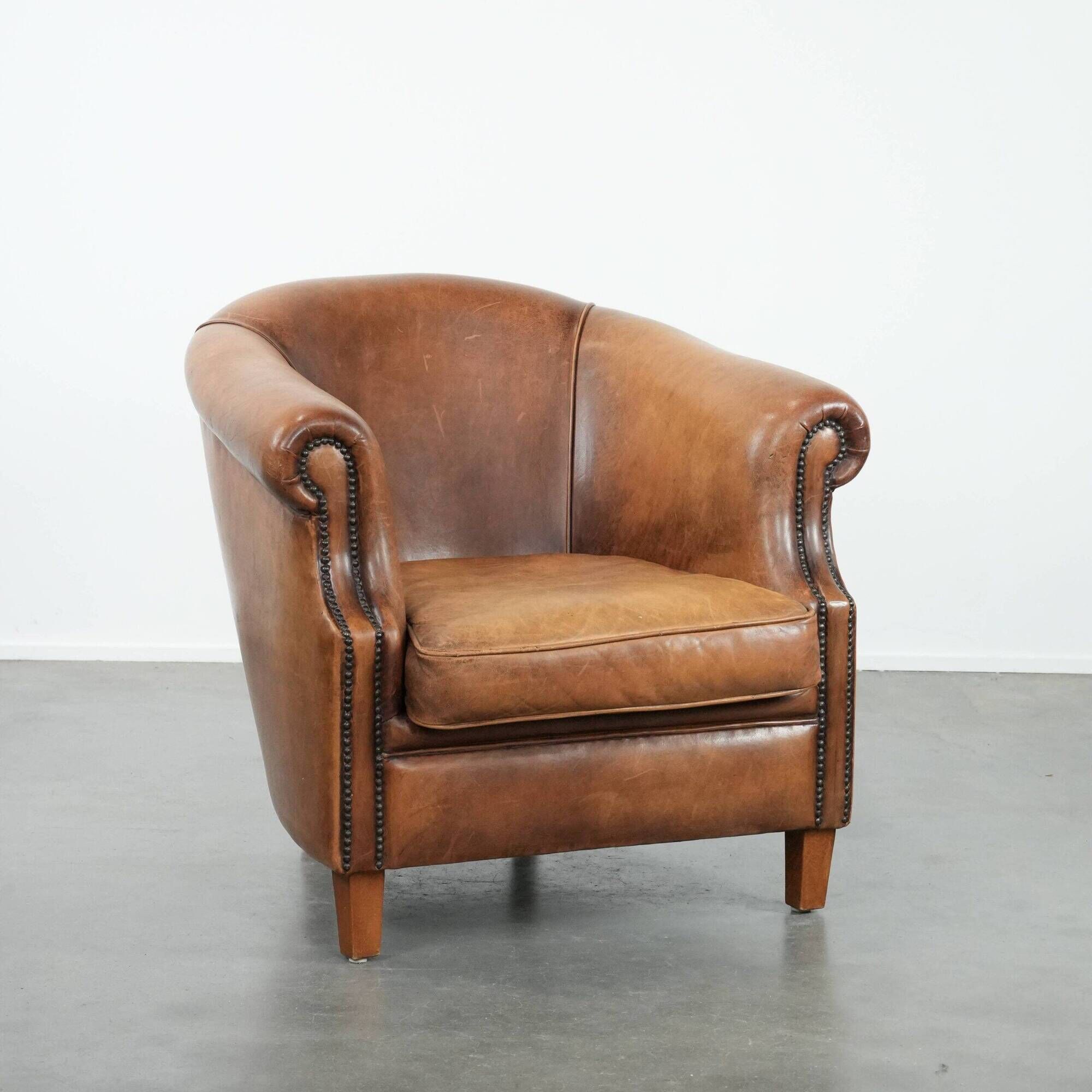 Comfortable club chair made of sheepskin leather