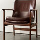Leather and wood armchair by Ib Kofod Larsen