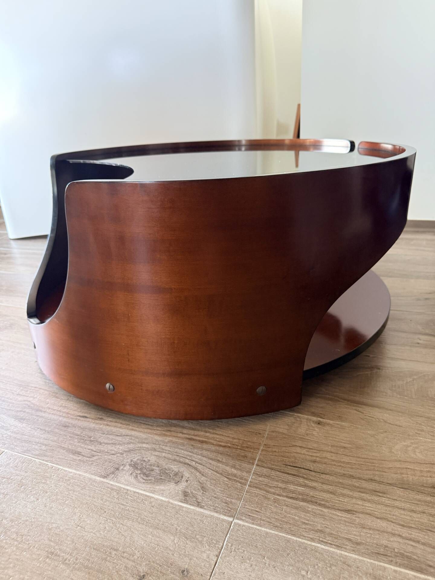 Italian Space Age coffee table in curved wood and smoked glass – 1970s