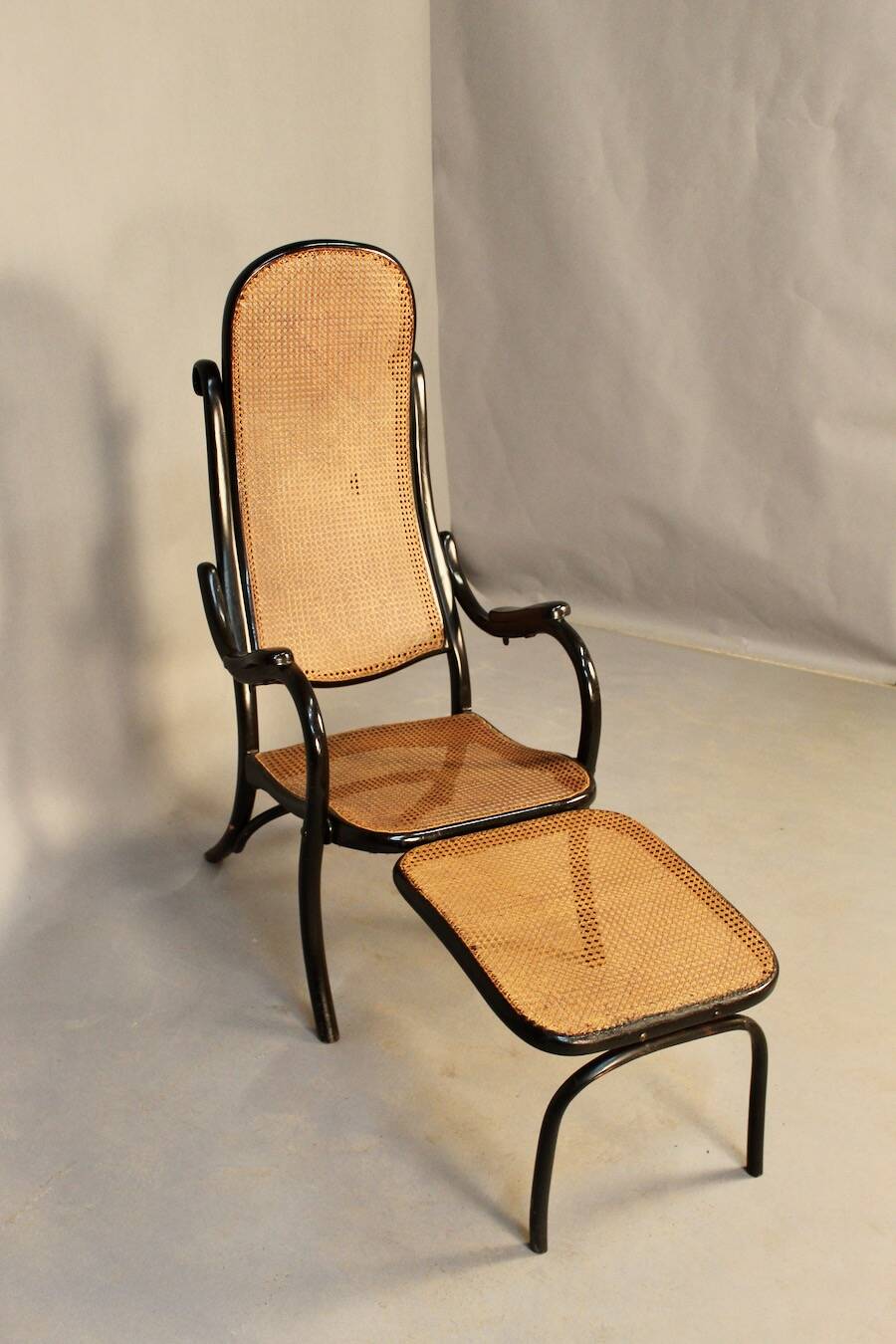 Bentwood cane armchair with mechanism and footrest