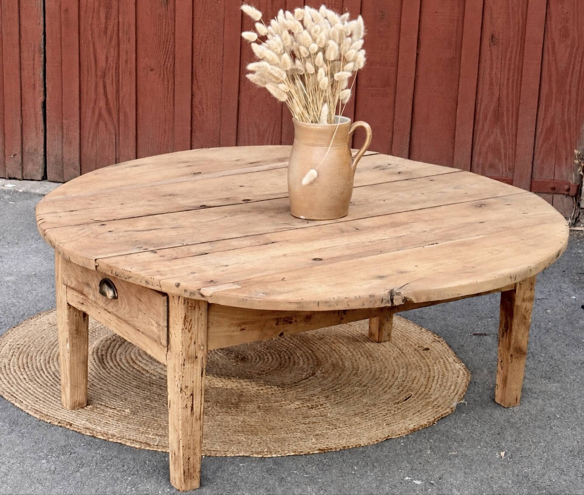 Round coffee table with 1 drawer, antique, made of raw solid wood.