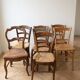 Set of 7 antique wooden and straw chairs.