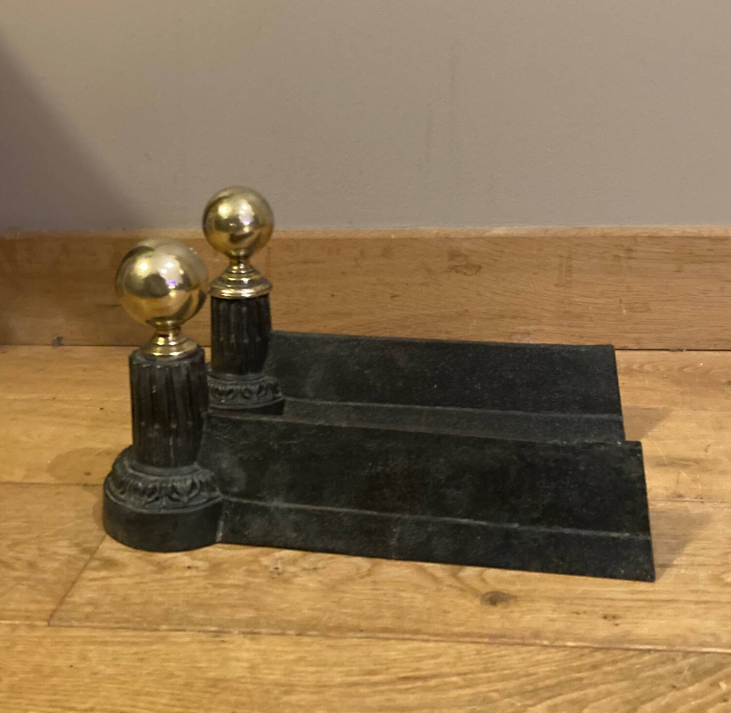 Pair of Napoleon III andirons from the 19th century in cast iron and brass