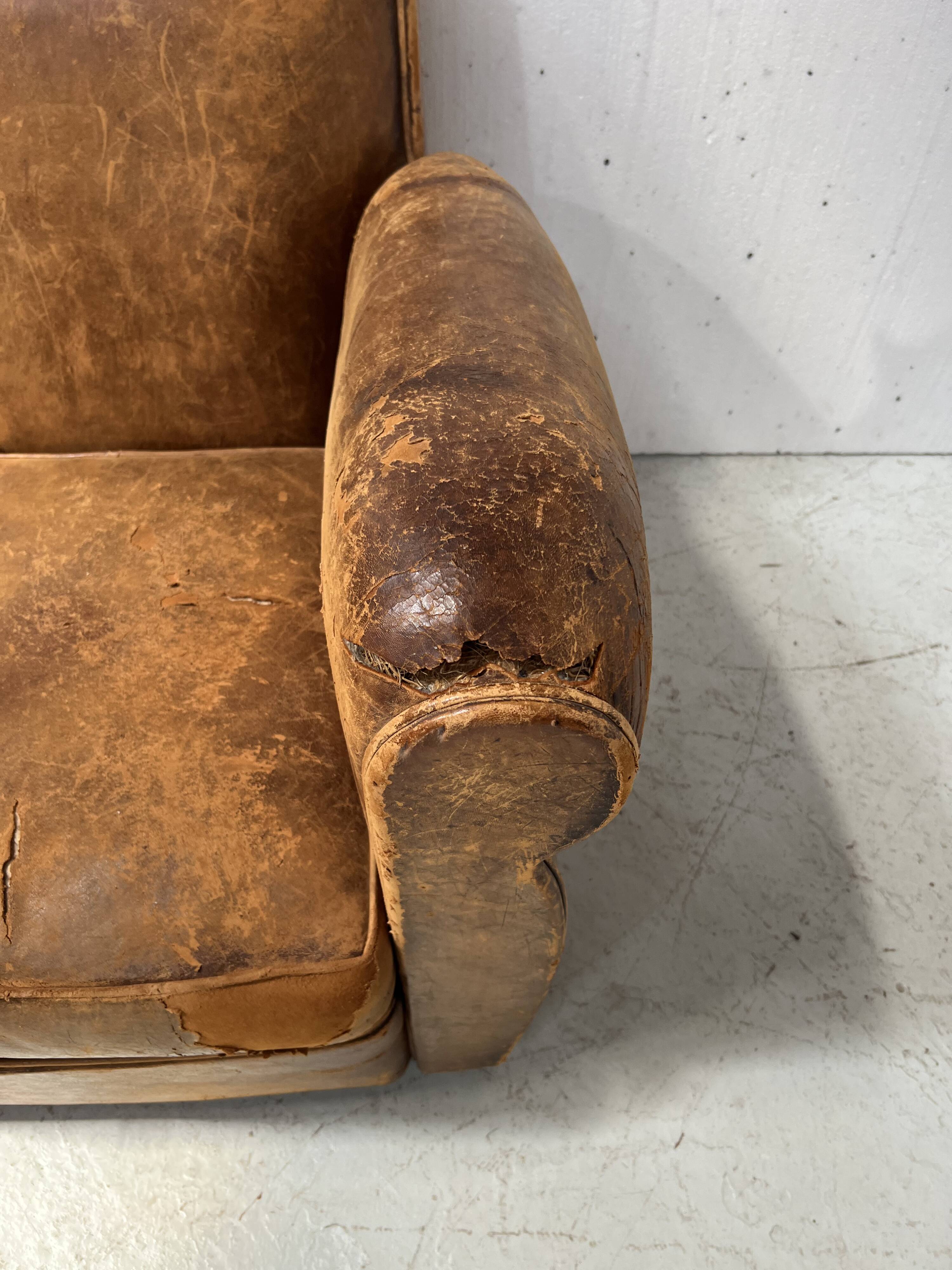Antique 20th century tan leather club armchair