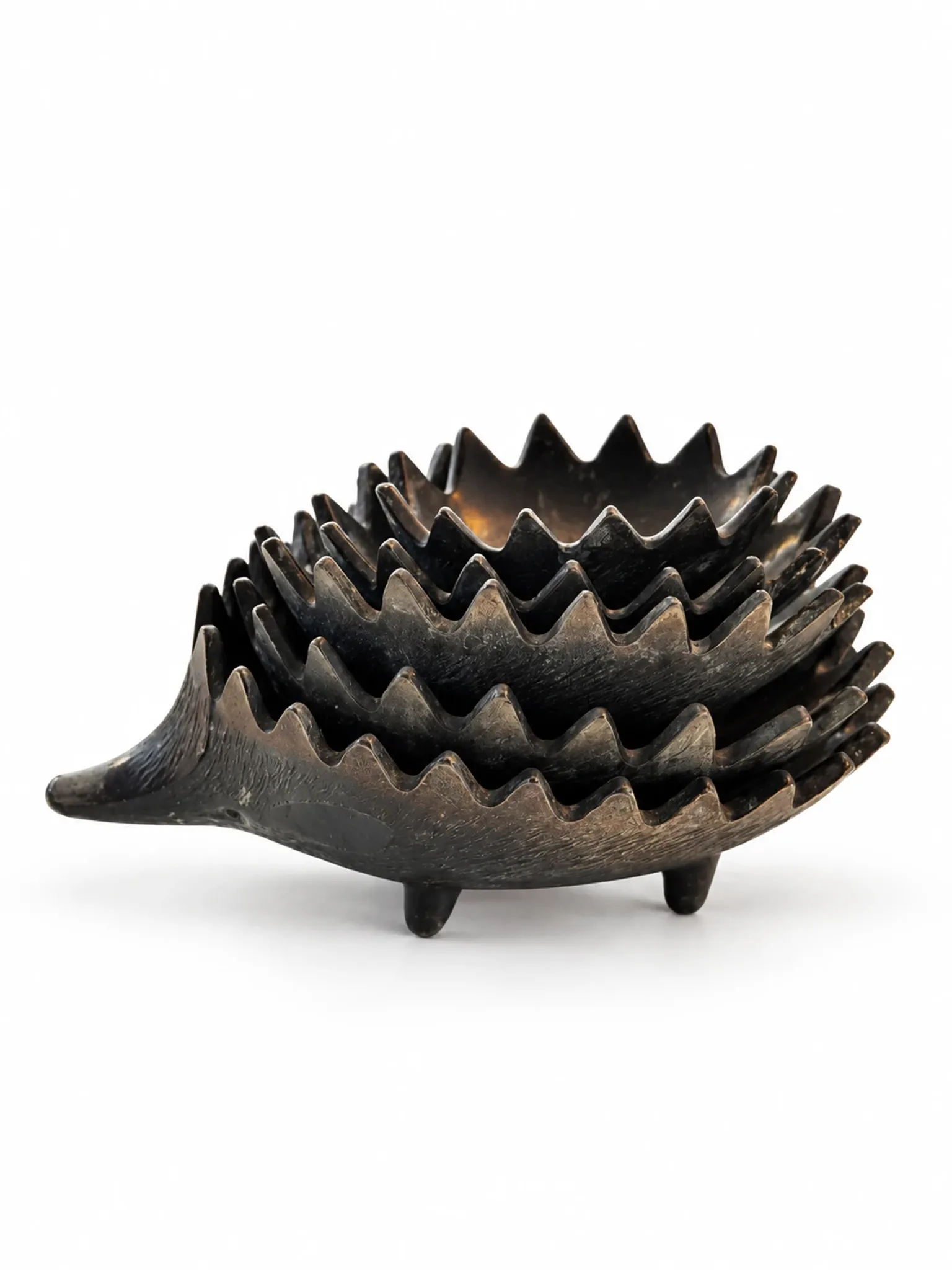 Nested hedgehogs in patinated brass – Walter Bosse