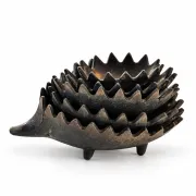 Nested hedgehogs in patinated brass – Walter Bosse