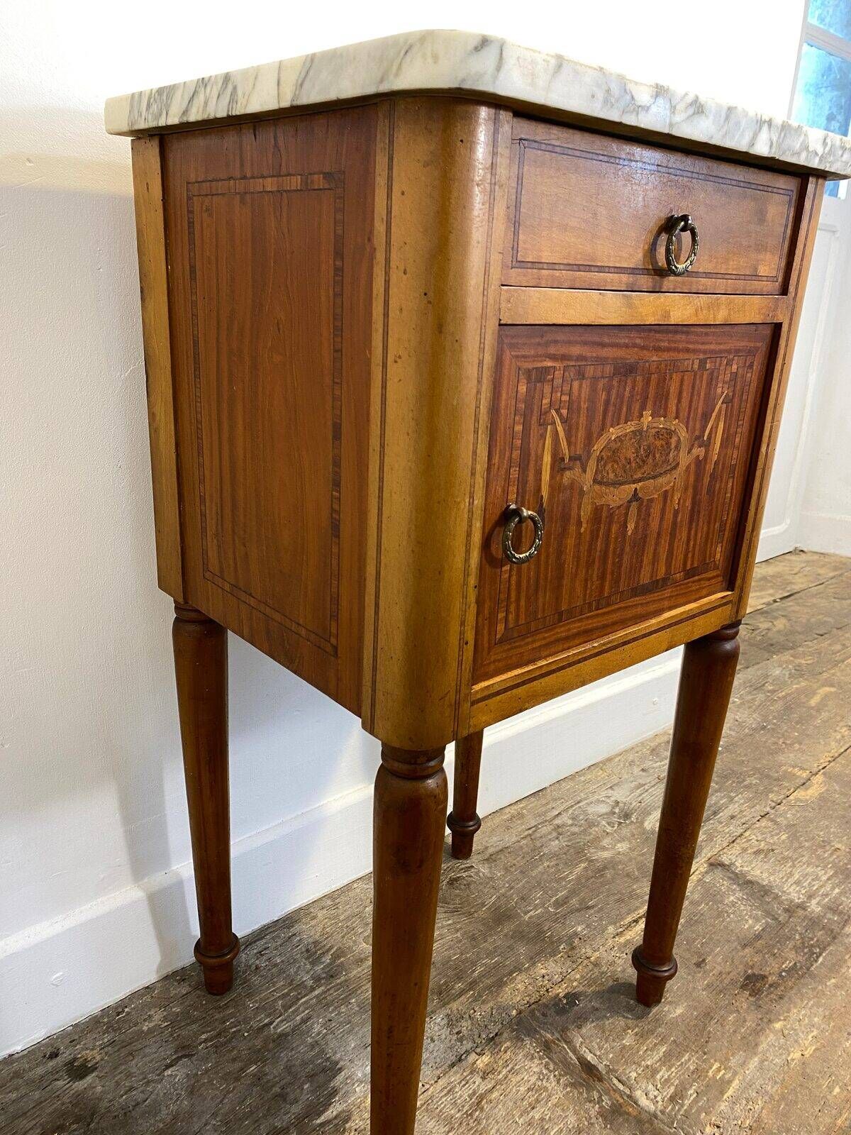 Louis XVI style bedside table, with a marble top and marquetry.