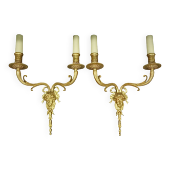 Pair of large sconces with male faces in Louis XVI style - bronze