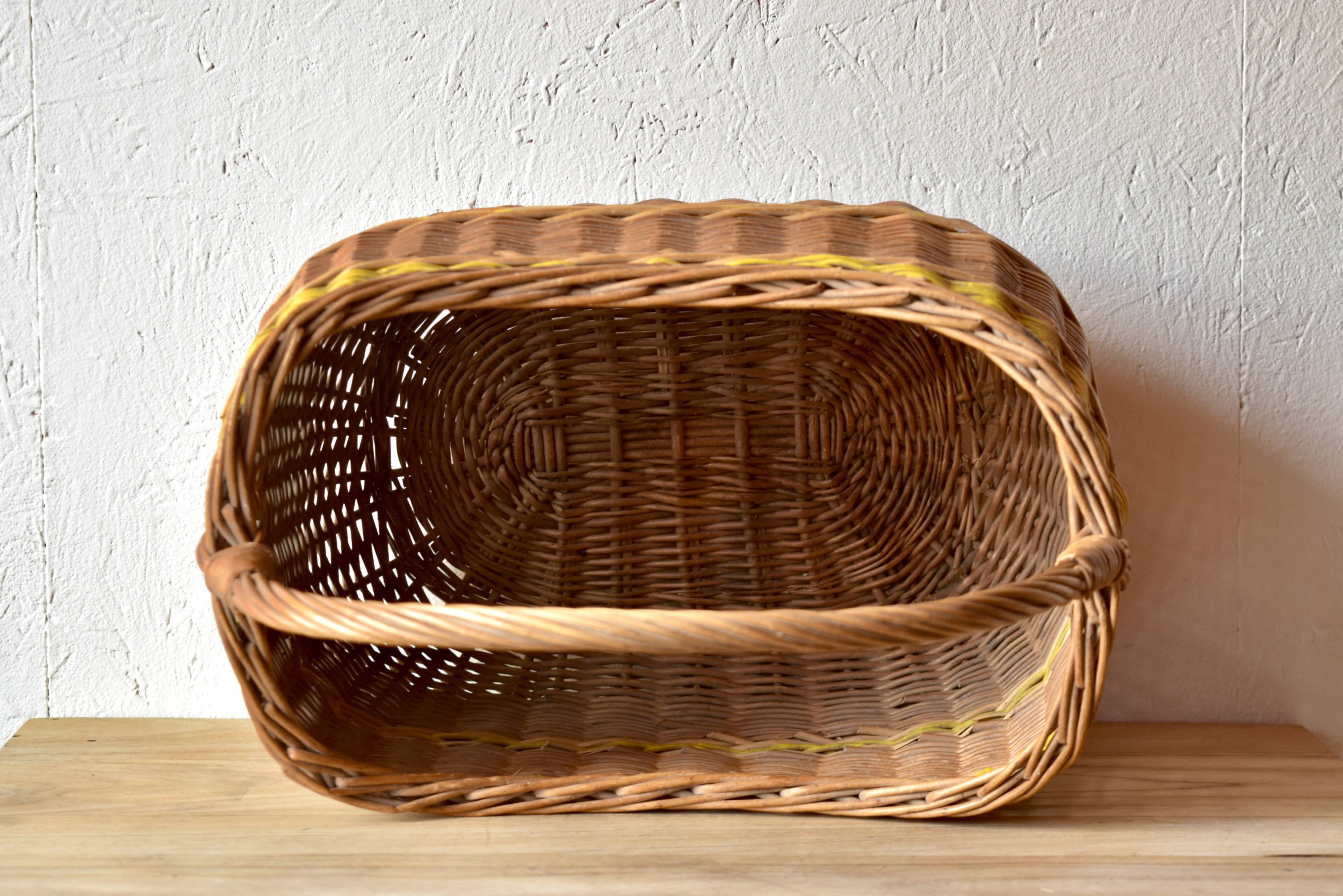 Vintage wicker basket crossed with a yellow scoubidou