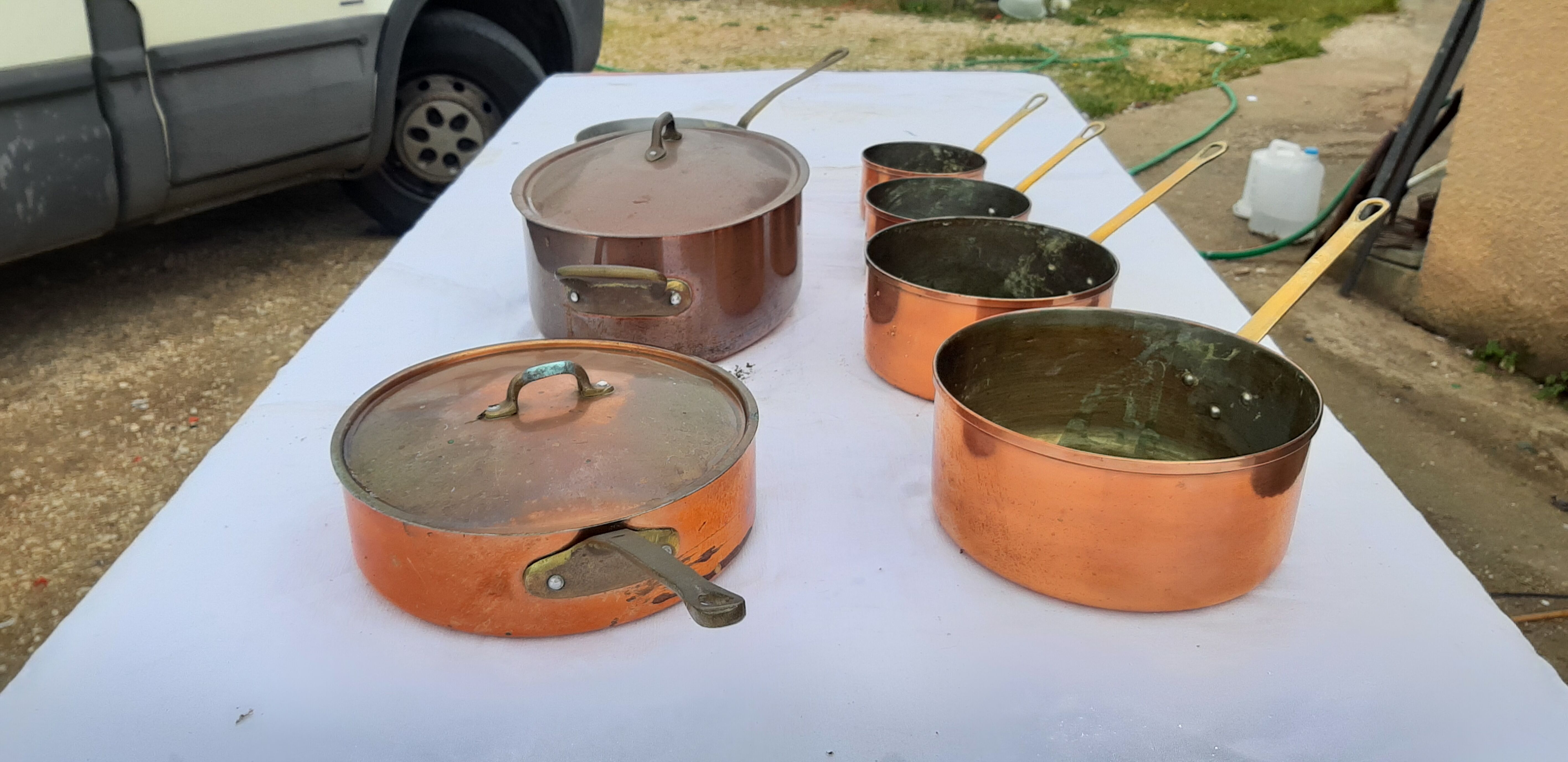 Lots of tinned copper kitchen utensils