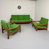 Living room sofa and Scandinavian design armchairs from the 1960s in green boucle.
