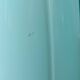 Large light blue opaline vase with a wavy neck.