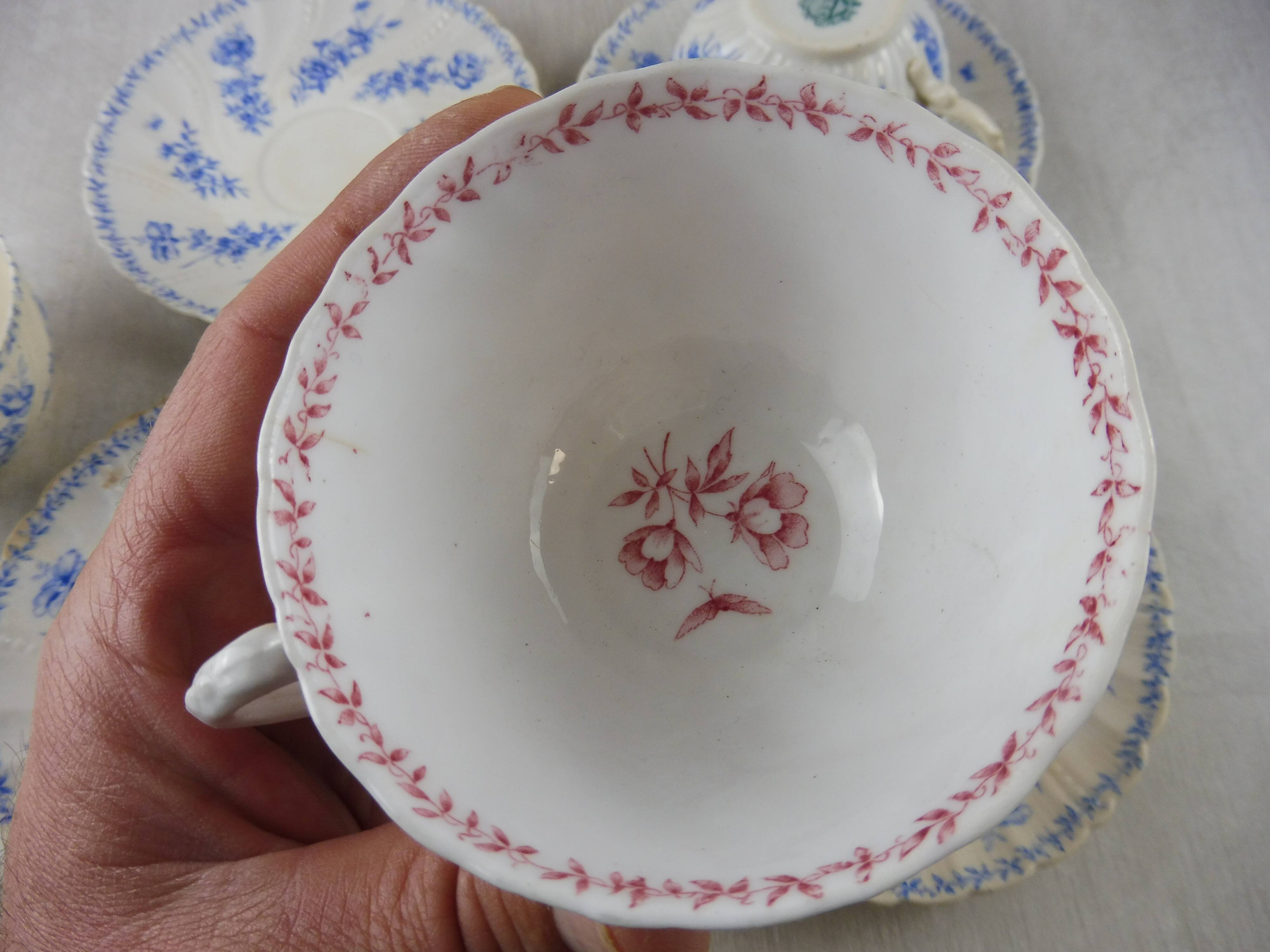 Lot of porcelain cups and under cups, twisted decoration, from Sarreguemines