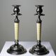 Pair of vintage candlestick holders in silver-plated metal with ivory-style plastic.