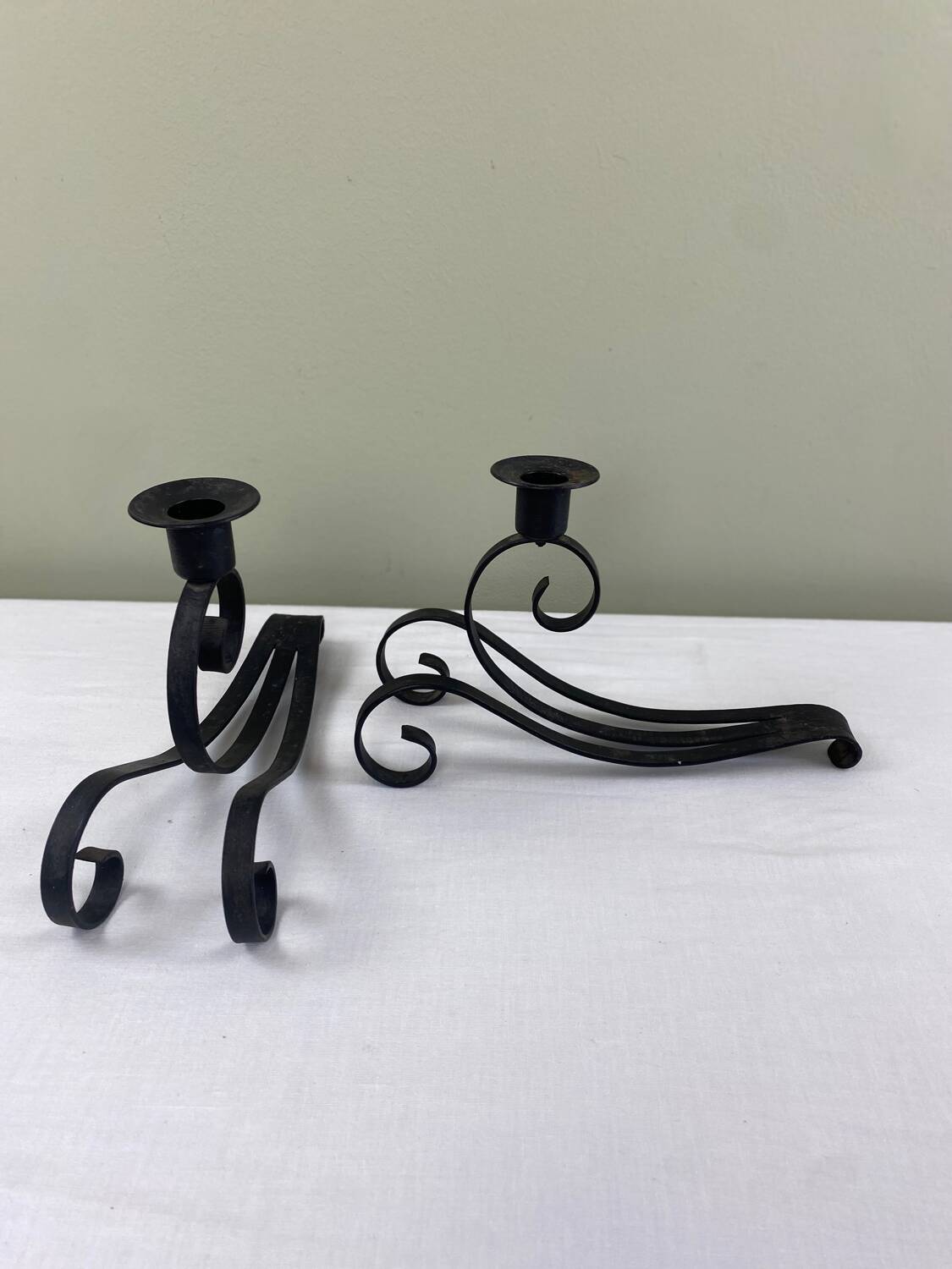 Pair of wrought iron candlesticks